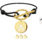 Bracelet cordon noir ajustable avec fermoir T et d'une pampille initiale en acier inoxydable doré