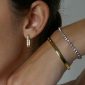 Bracelet rivière d'oxydes de zirconium en acier inoxydable doré