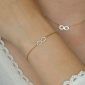 Bracelet signe infini oxydes de zirconium en acier inoxydable doré