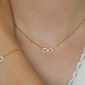 Collier signe infini oxydes de zirconium en acier inoxydable doré