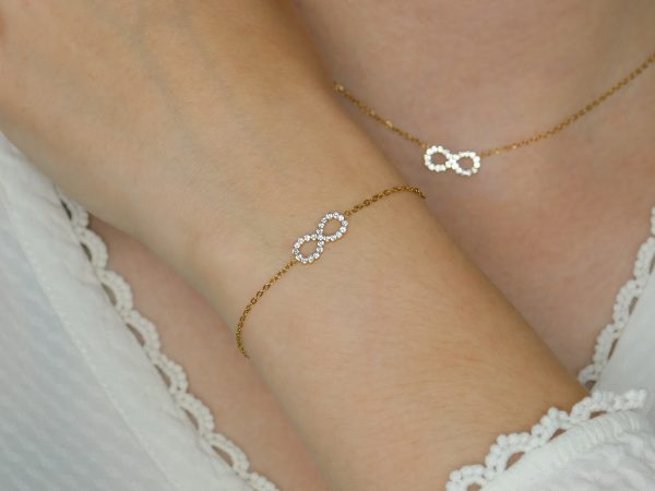 Bracelet signe infini oxydes de zirconium en acier inoxydable doré